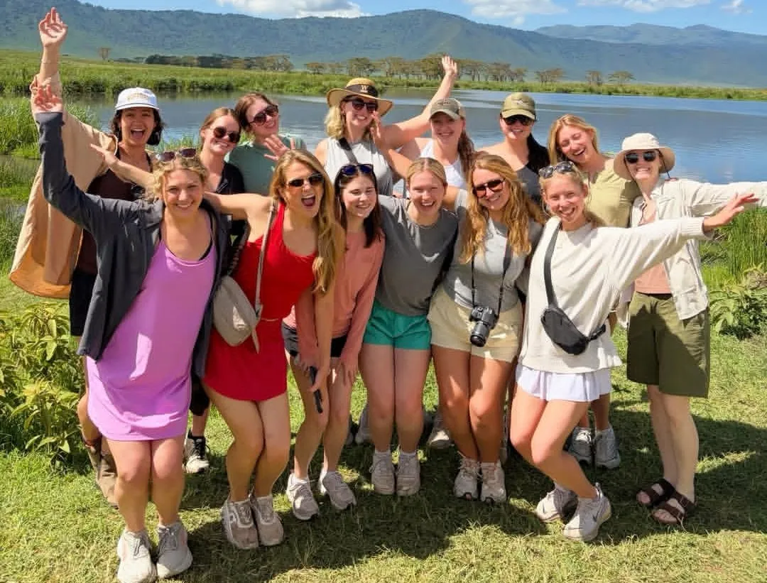 Guests clinking glasses at a Serengeti sundowner